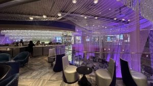 Chandeliers hanging from the ceiling on the bar's second level